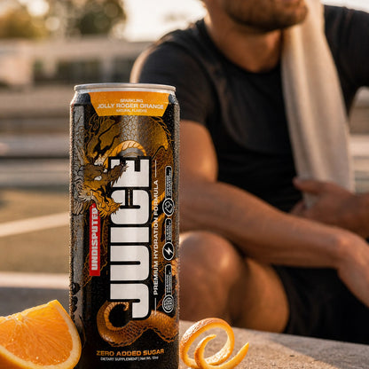 JUICE Sparkling Electrolytes: Orange 24 pack lifestyle shot in a gym setting